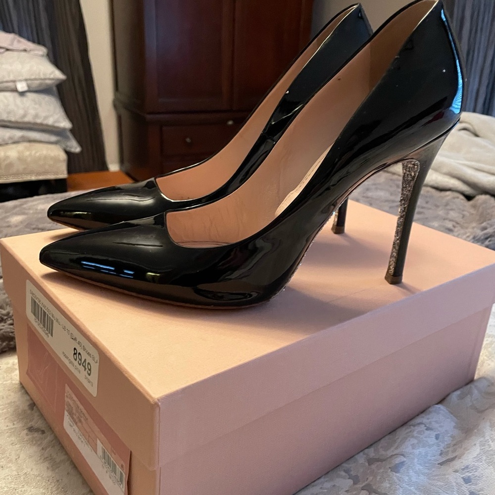 Miu Miu Black patent leather pumps with glitter bottoms